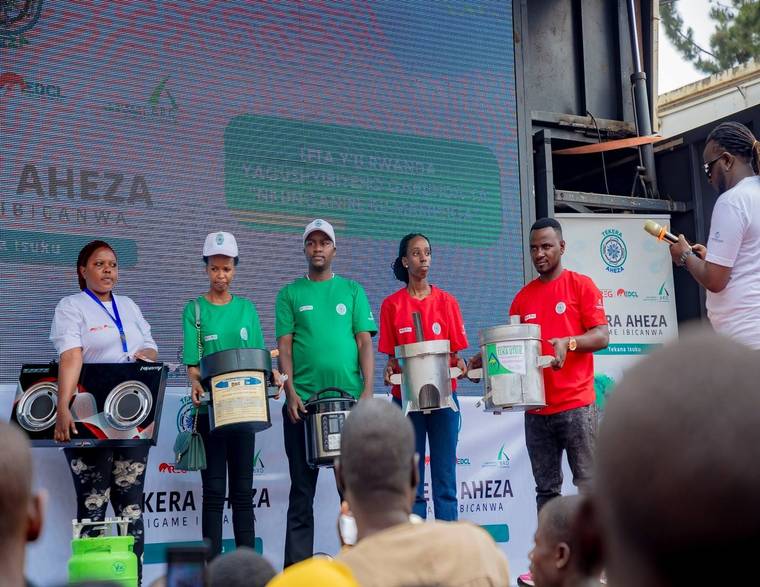 Improved cookstoves presented on stage at a clean cooking campaign event in Rwanda